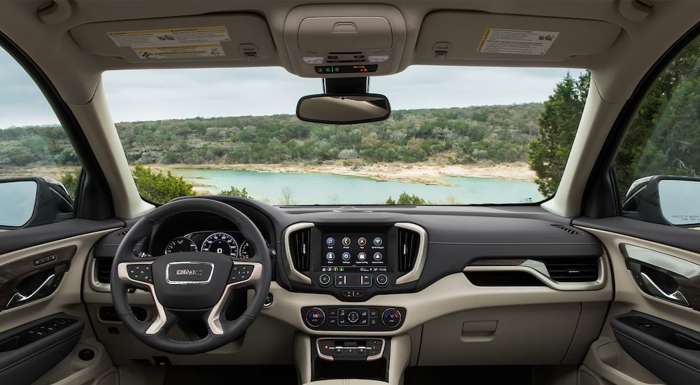 The steering wheel and dashboard in a 2024 GMC Terrain Denali.