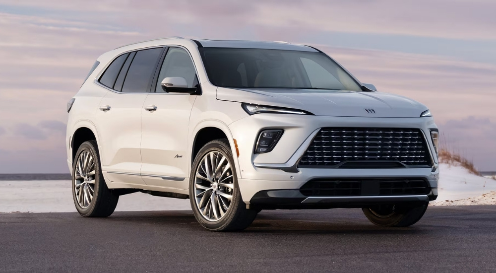 A white 2025 Buick Enclave for sale is shown from the front.