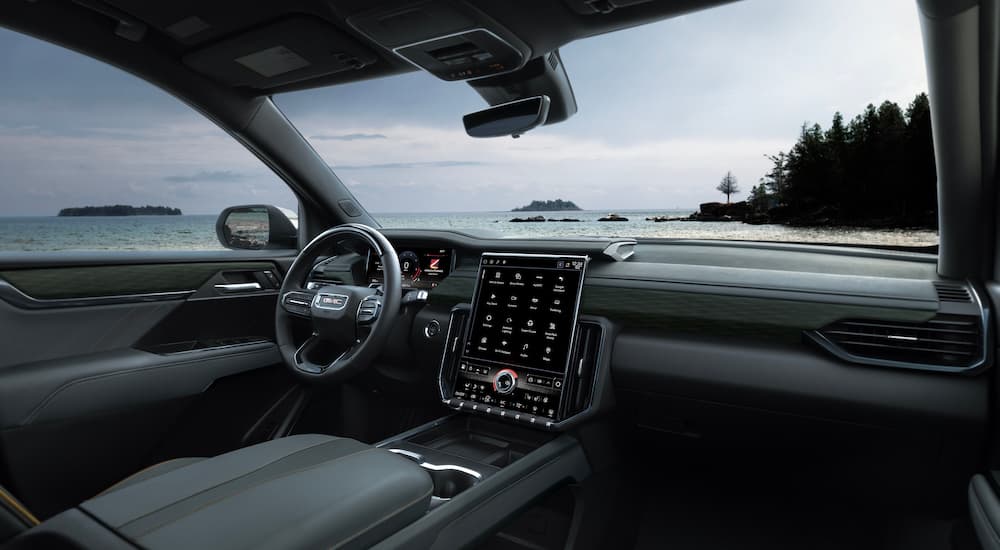 The black interior of a 2025 GMC Acadia for sale is shown.