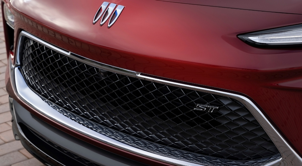 A red 2025 Buick Encore GX grille close-up.