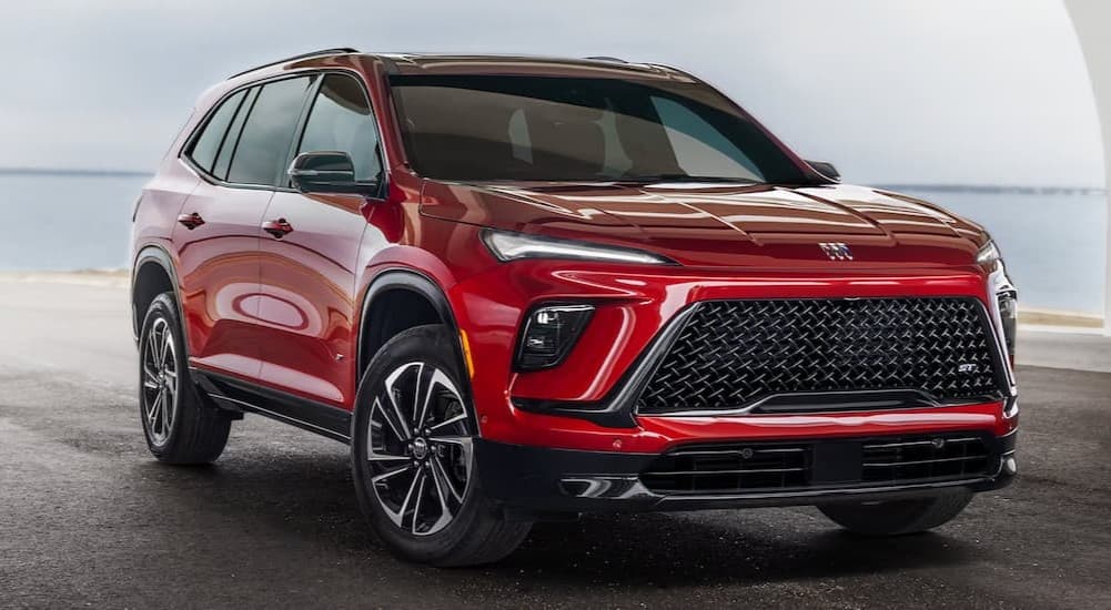 A red 2025 Buick Enclave parked outdoors.