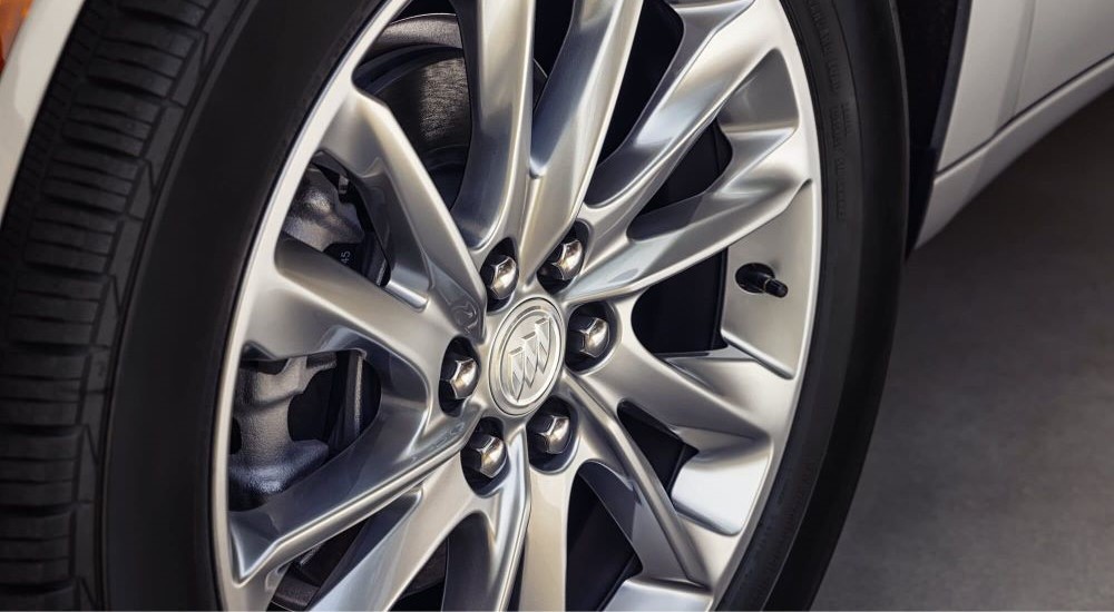 Close-up of tire and wheel on a 2023 Buick Enclave Avenir.