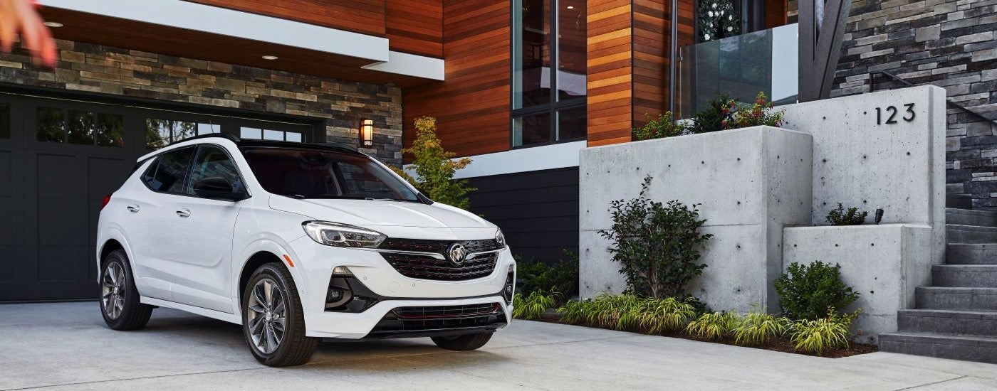 A white 2020 Buick Encore GX ST parked in a driveway.