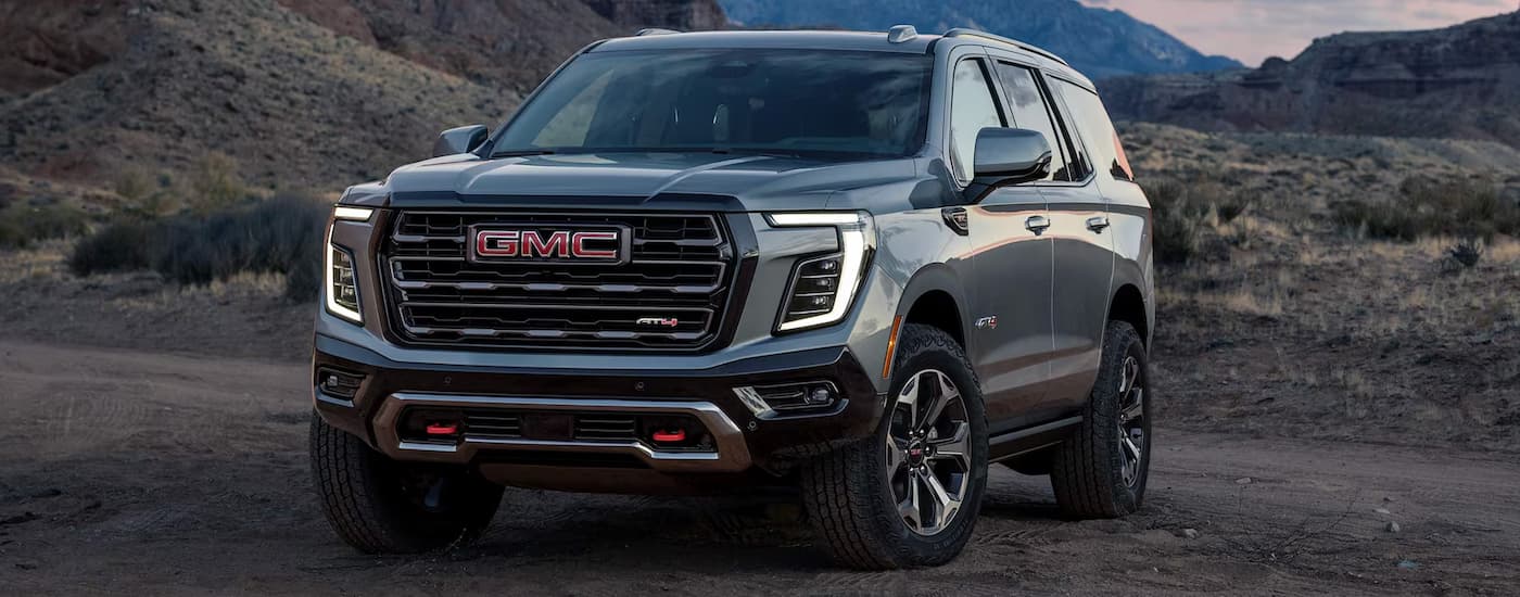 Grey 2025 GMC Yukon AT4 parked off-road