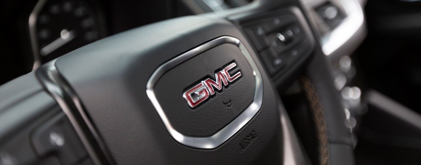 A close up shows the steering wheel in a 2021 GMC Yukon AT4.