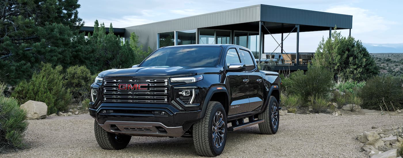 A black 2024 GMC Canyon from the front after the owner searched how to 'sell my car'.