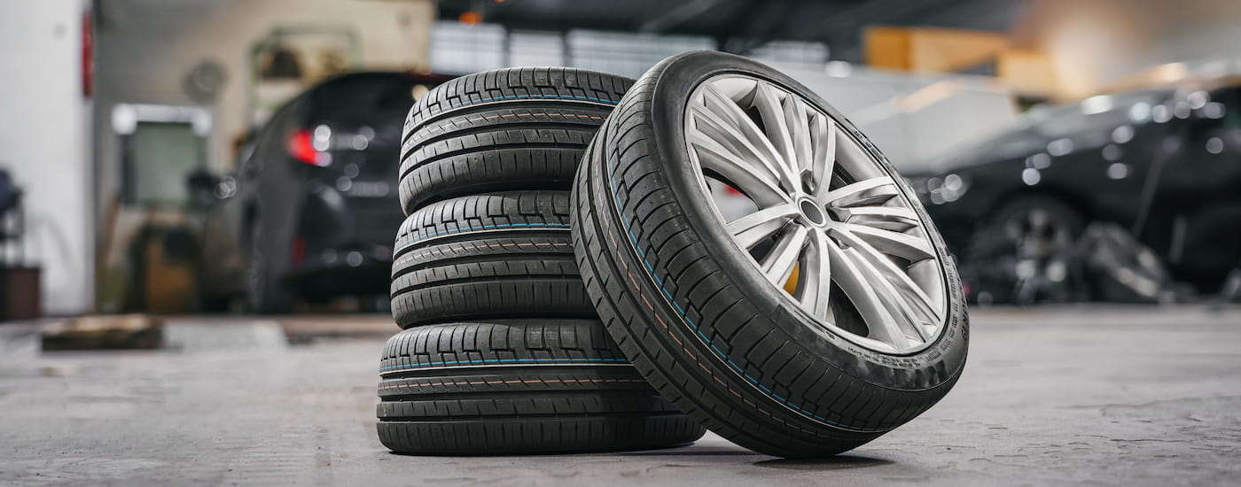 Close-up on a stack of tires in a garage.
