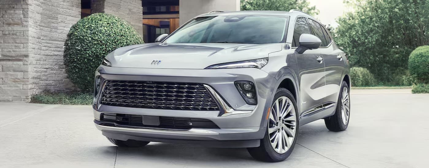 A silver 2026 Buick Envision Avenir parked on a driveway.